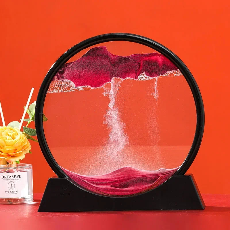Black framed sand art rotating ornament with red sand