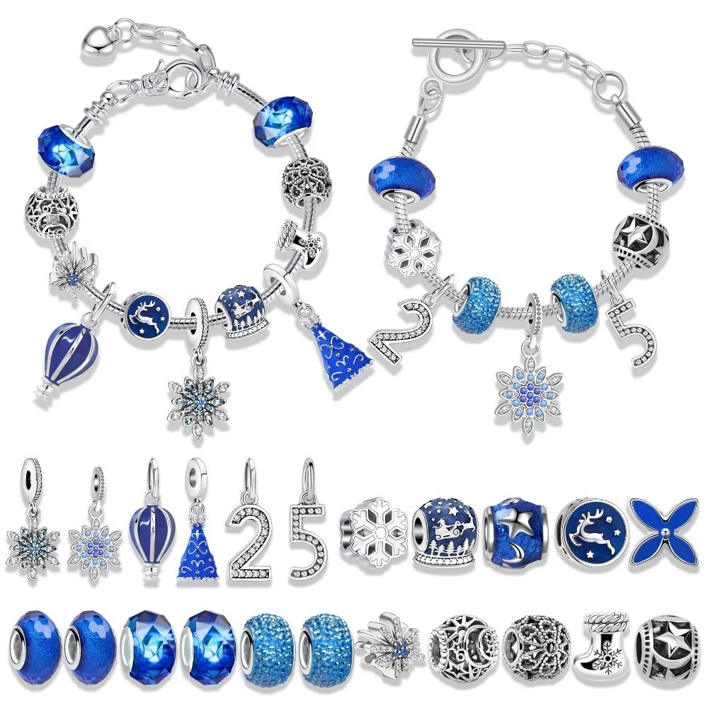 Set of blue and silver charm bracelets with various charms on a white background