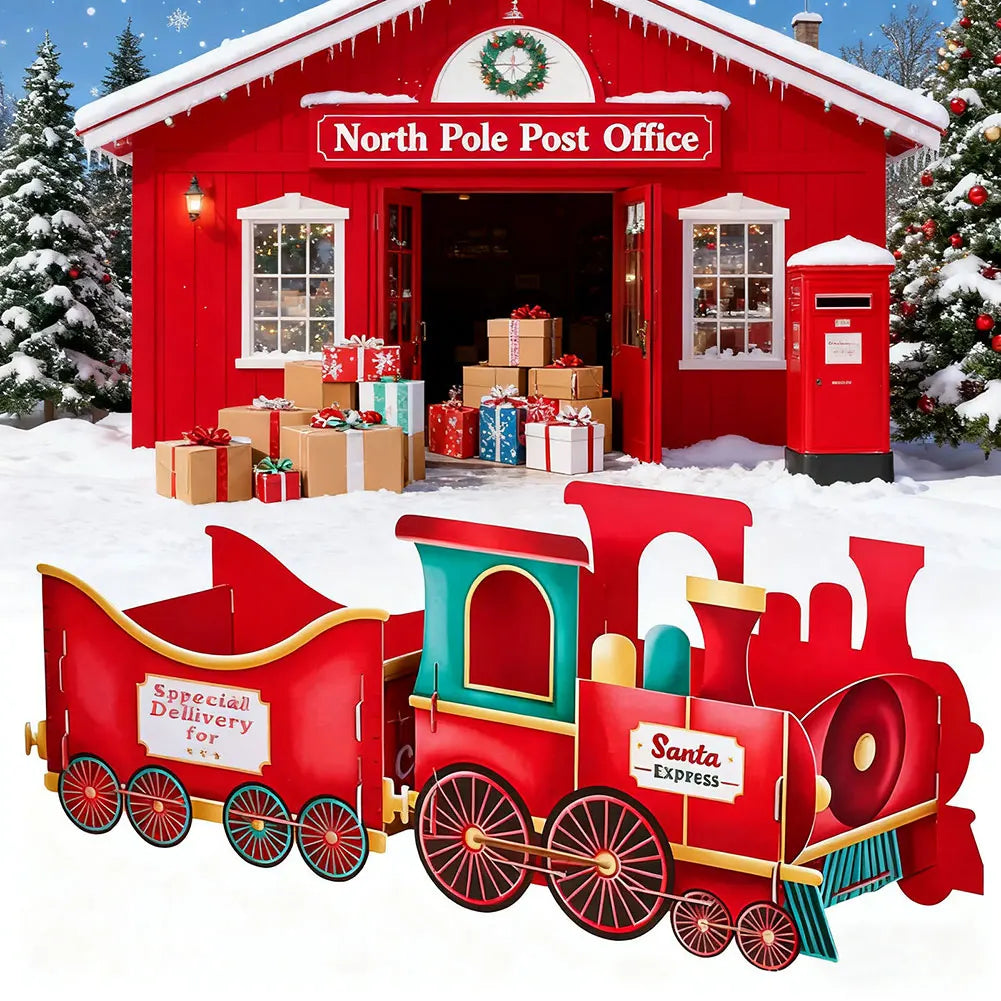 Red North Pole Train Gift Holdere Set Post Office with a toy train in front, surrounded by snow and Christmas trees.