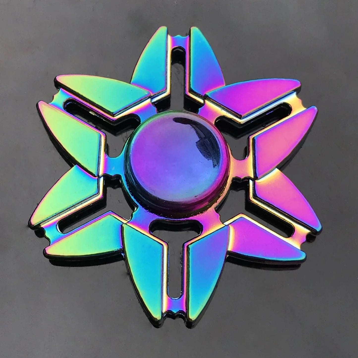 Multicolored fidget spinner funk design on a dark background