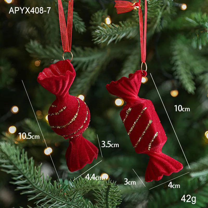 Red candy-shaped ornaments with gold stripes on a Christmas tree, showing measurements.