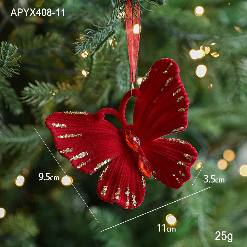 Red butterfly ornament with gold accents on a Christmas tree, showing measurements.