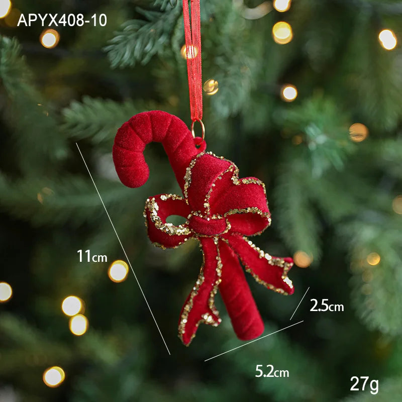 Red candy cane ornament with gold accents on a Christmas tree, showing measurements.