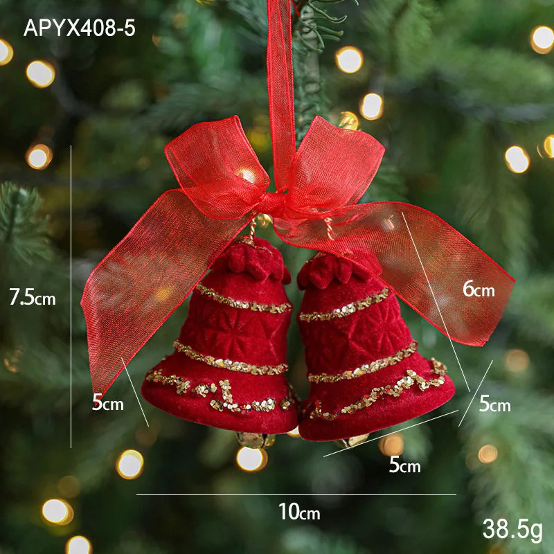 Red Christmas bell ornament with gold accents and a red bow, shown with measurements against a blurred Christmas tree background.