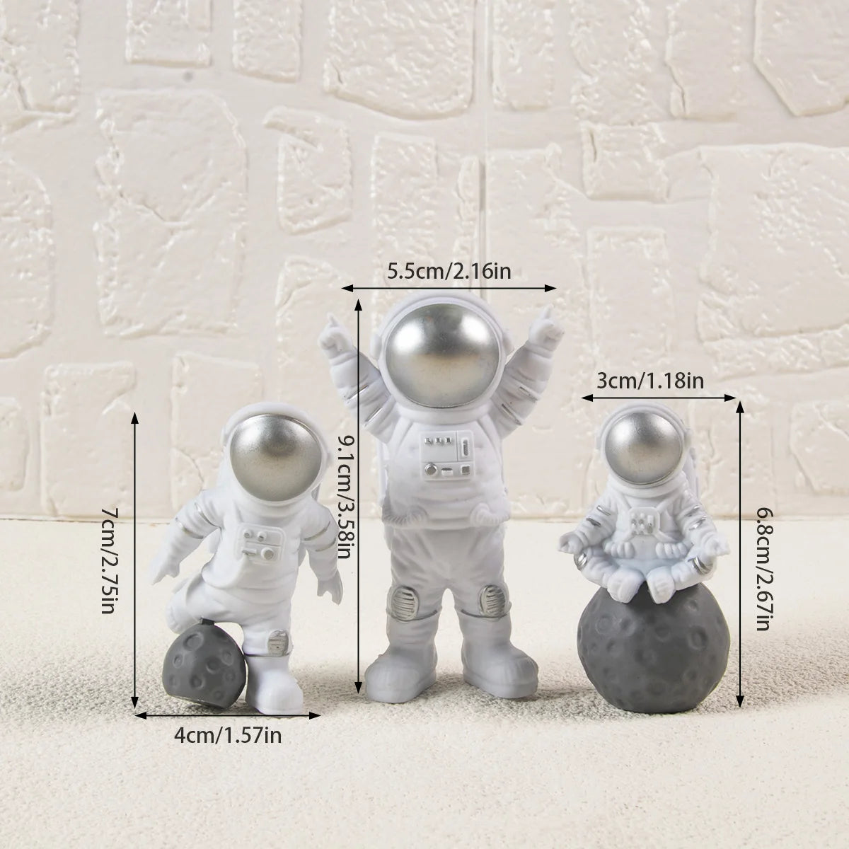 Silver and white astornaut cake topeprs