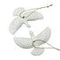 Two white dove ornaments with gold chains on a white background