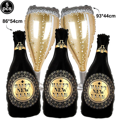 Three inflatable 'Happy New Year' champagne bottles with gold labels on a white background including 2 champagne glasses