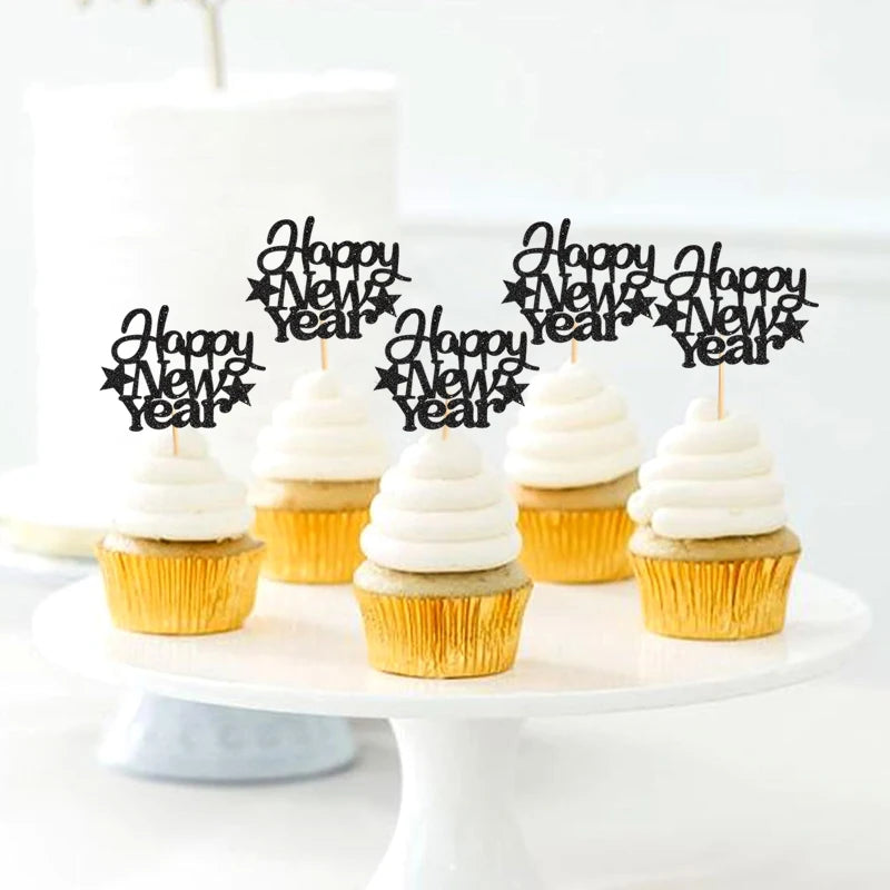 Cupcakes with 'Happy New Year' toppers on a white cake stand.