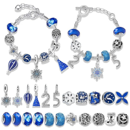 Set of blue and silver charm bracelets with various charms on a white background