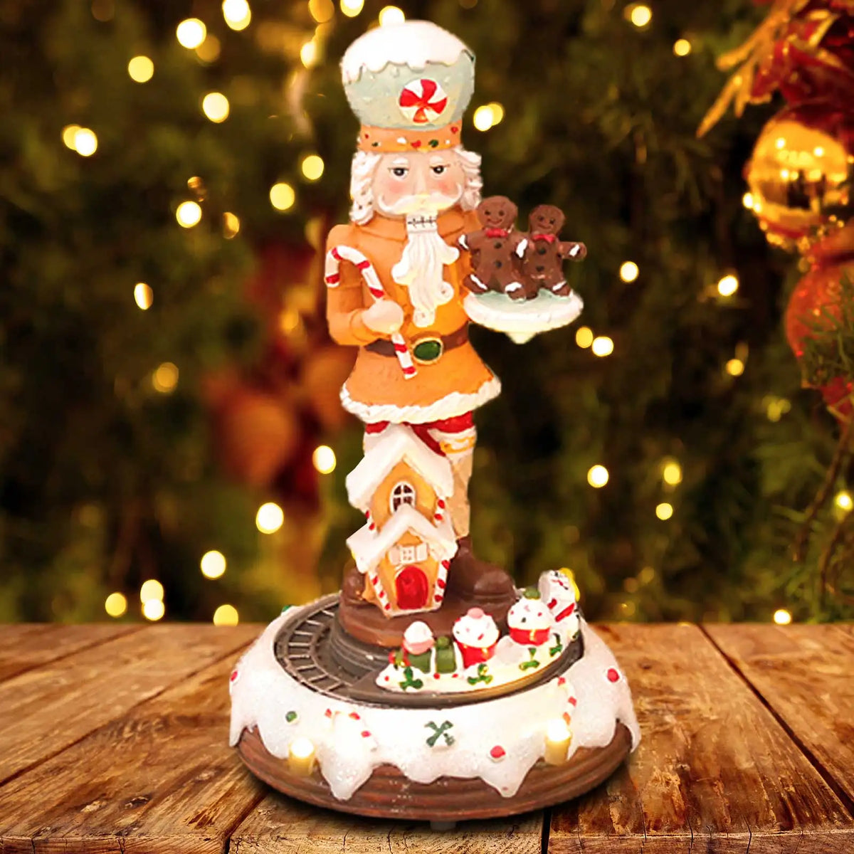 Decorative Christmas nutcracker with gingerbread men on a wooden table with a festive background.