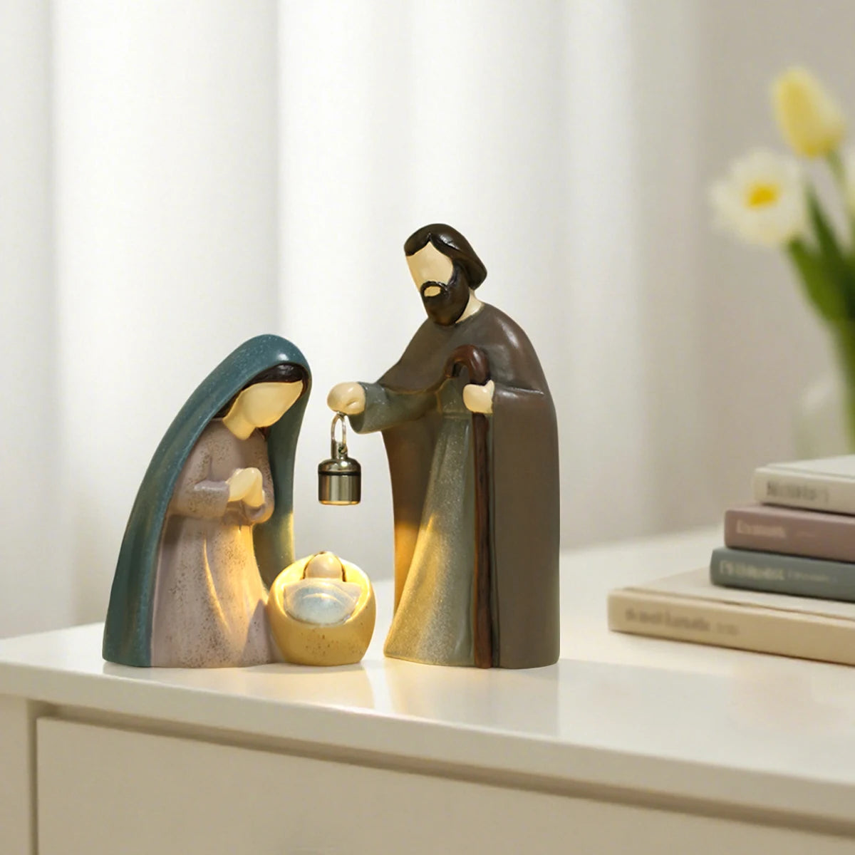 Decorative nativity scene with a stable, baby Jesus, and a standing figure on a shelf.
