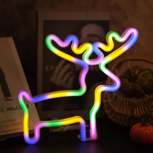 A colorful LED neon light decoration shaped like a reindeer, displayed indoors against a dark background.