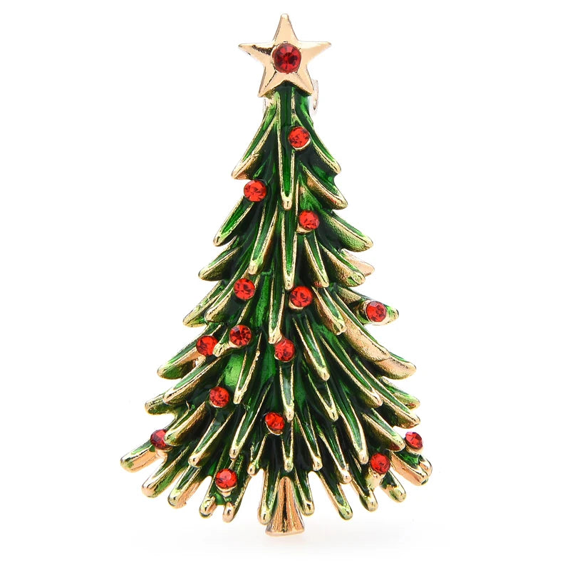Christmas tree-shaped brooch with red gemstones on a white background