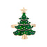 Green Christmas tree-shaped brooch with gold accents on a white background