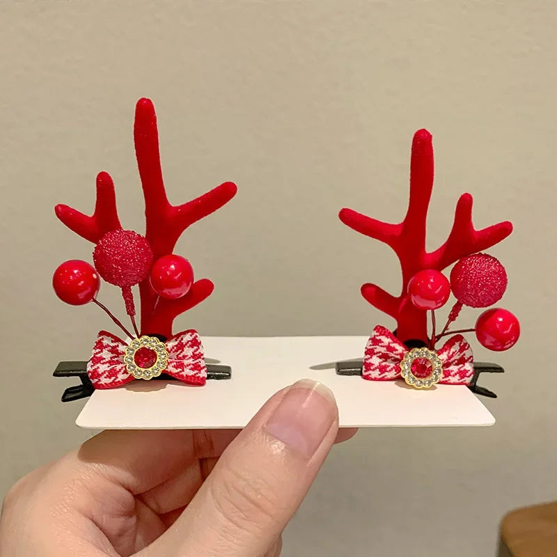 Christmas hair clips reindeer ears red with red bows and berries