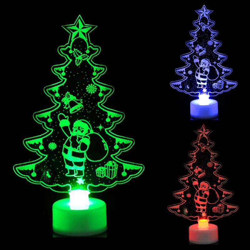 Three Christmas tree-shaped night lights in green, blue, and red on a black background.