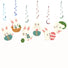 Decorative hanging swirls with cartoon bunnies and Easter eggs on a white background
