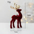 Red deer figurine with gold antlers on a light gray background, showing measurements.