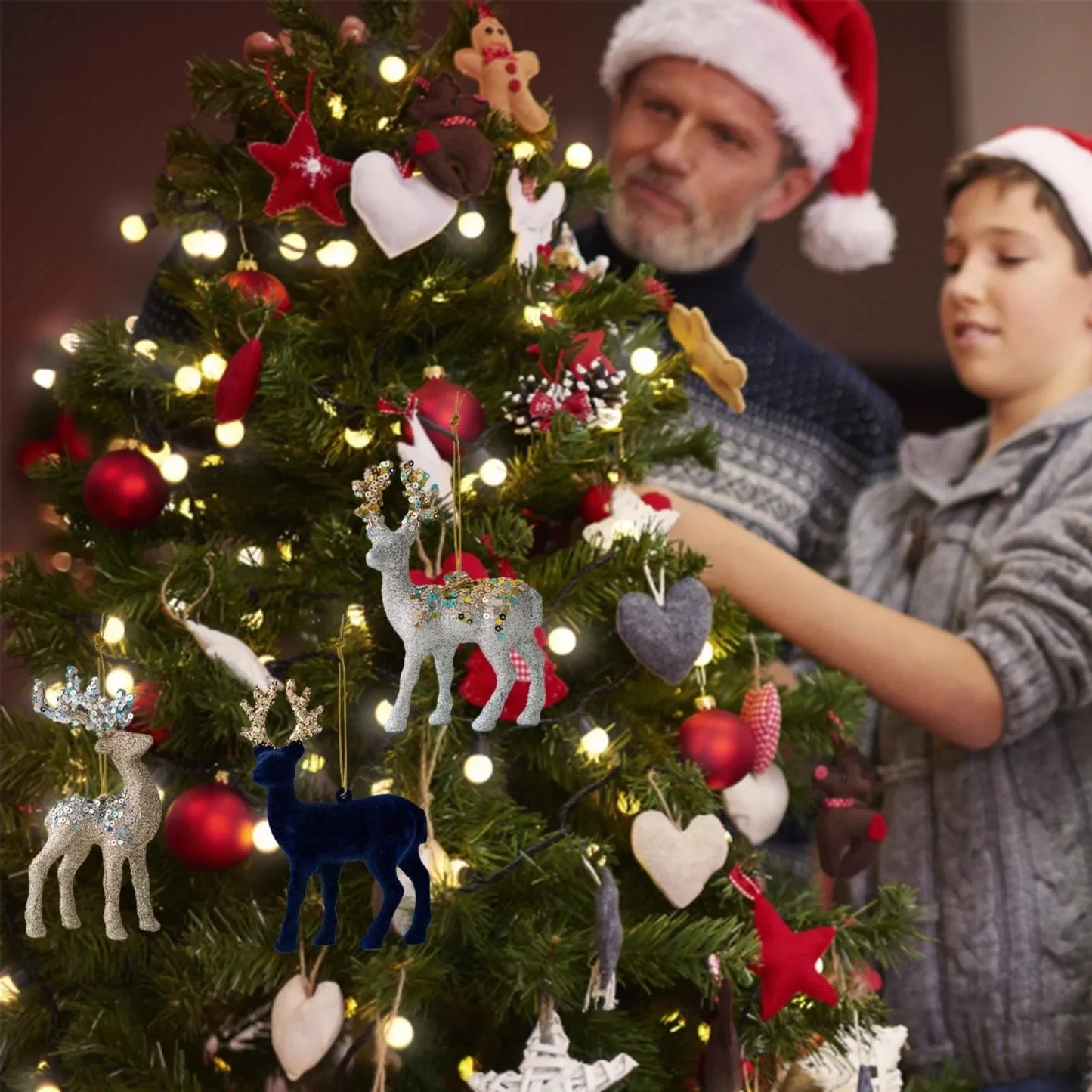 Two people decorating a Christmas tree with ornaments and lights.