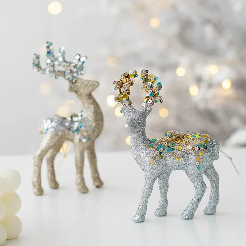 Decorative deer figurines with sequin details on a blurred background