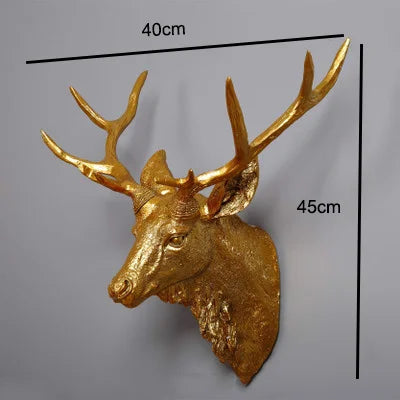 Antique Gold deer head wall decoration with measurements on a gray background