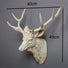 Decorative deer head mount  antique white with measurements on a gray background