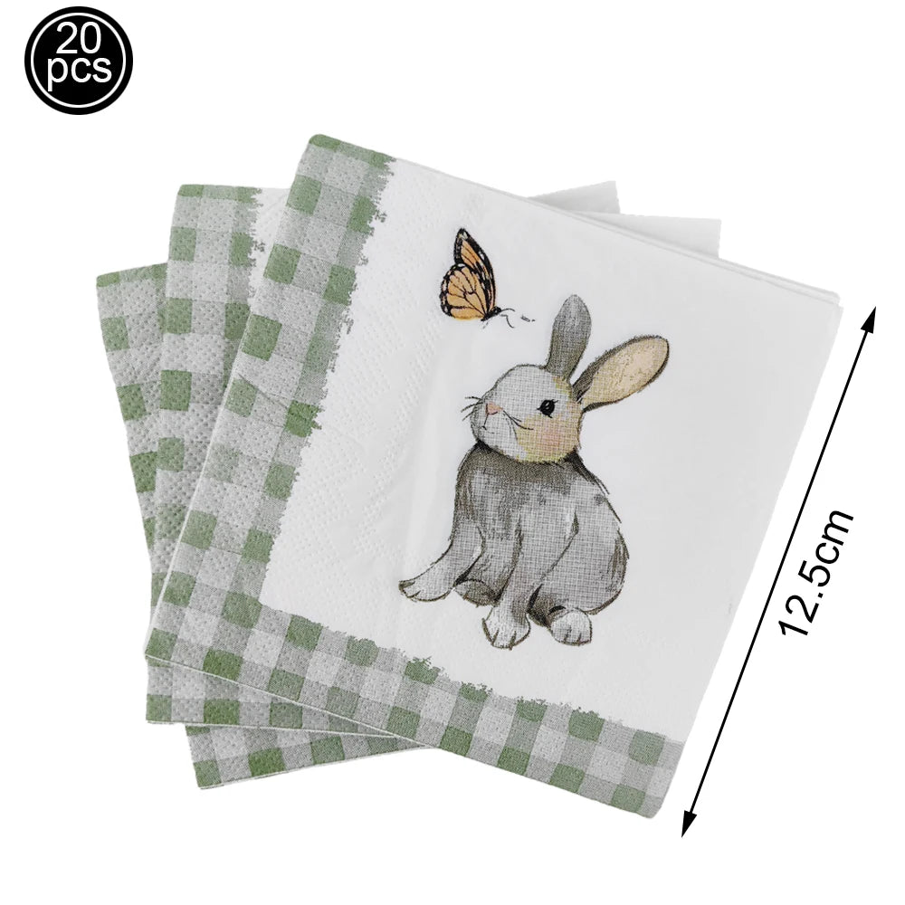 Set of napkins with a rabbit and butterfly design, including green checkered napkins.