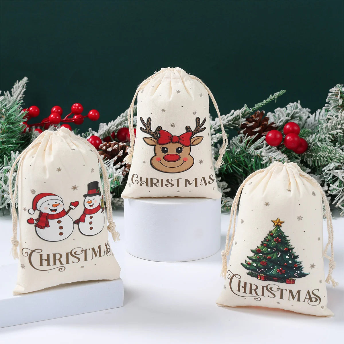 Three Christmas-themed drawstring bags with festive designs on a white surface with a green background.