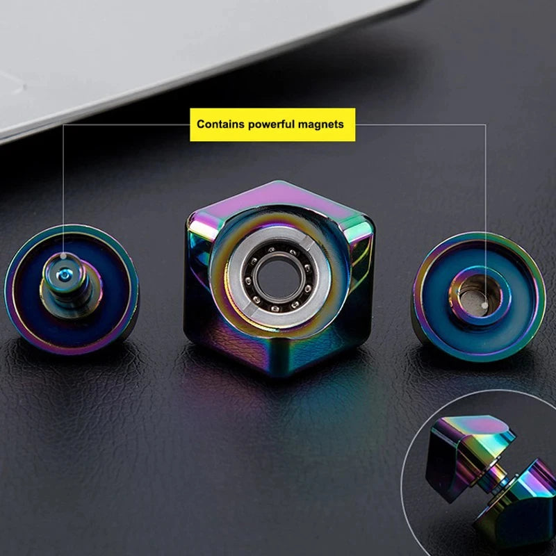 Colorful metallic object with a central bearing and 'Contains powerful magnets' text on a dark surface.