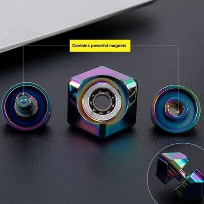 Colorful metallic object with a central bearing and 'Contains powerful magnets' text on a dark surface.
