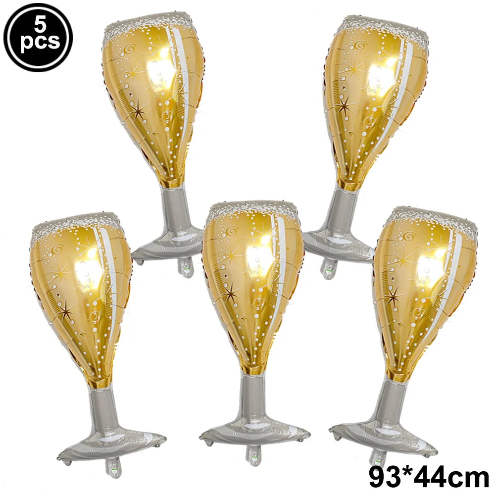 Five gold and silver inflatable champagne glass balloons on a white background.