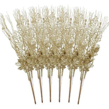 Set of gold decorative sticks with floral designs on a white background