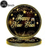 Stack of 'Happy New Year' plates with gold text on a black background