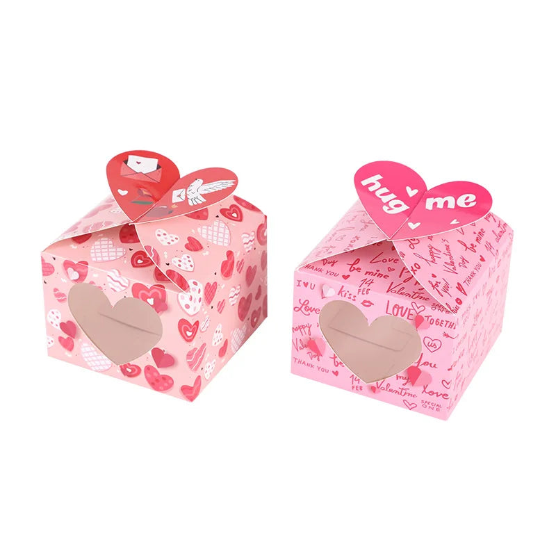 Two pink heart-shaped gift boxes with Valentine's Day text and designs on a white background.