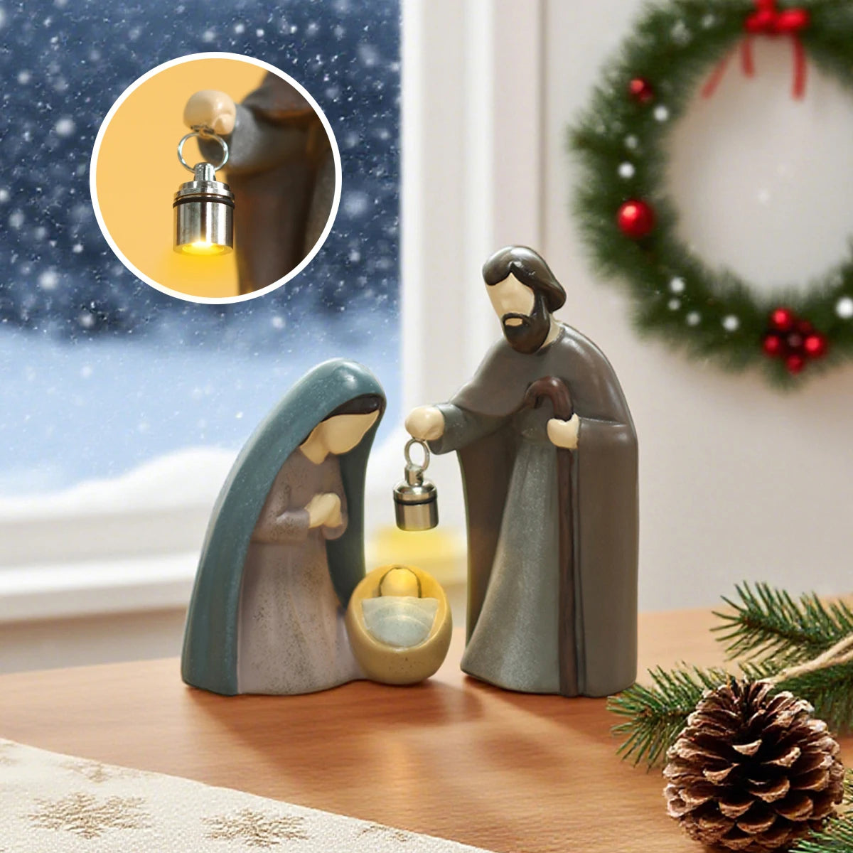 Nativity scene figurines with a light bulb in a snowy window setting.