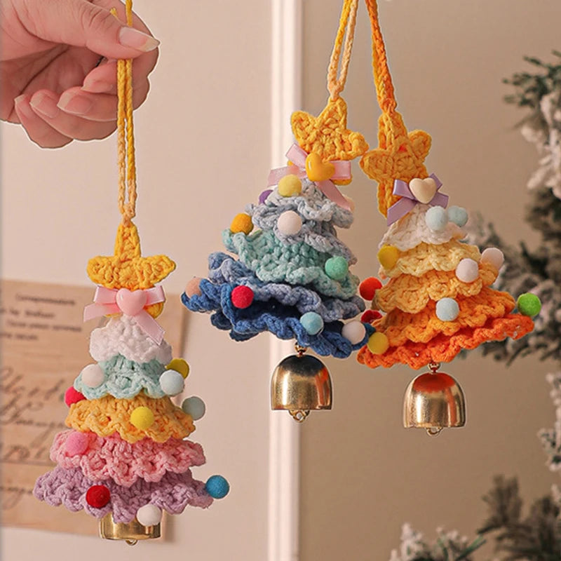 Colorful crocheted Christmas tree ornaments with bells against a neutral background
