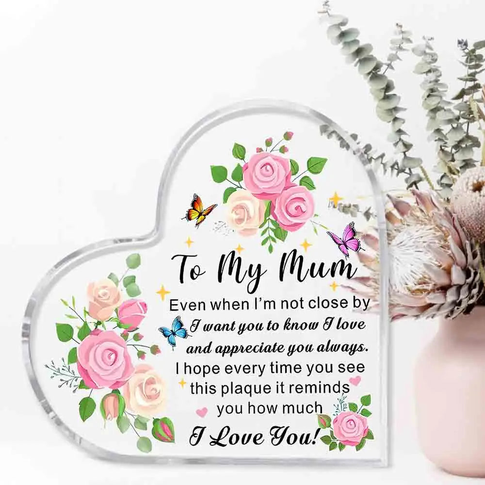 Heart-shaped plaque with floral design and message to 'My Mum' on a white background