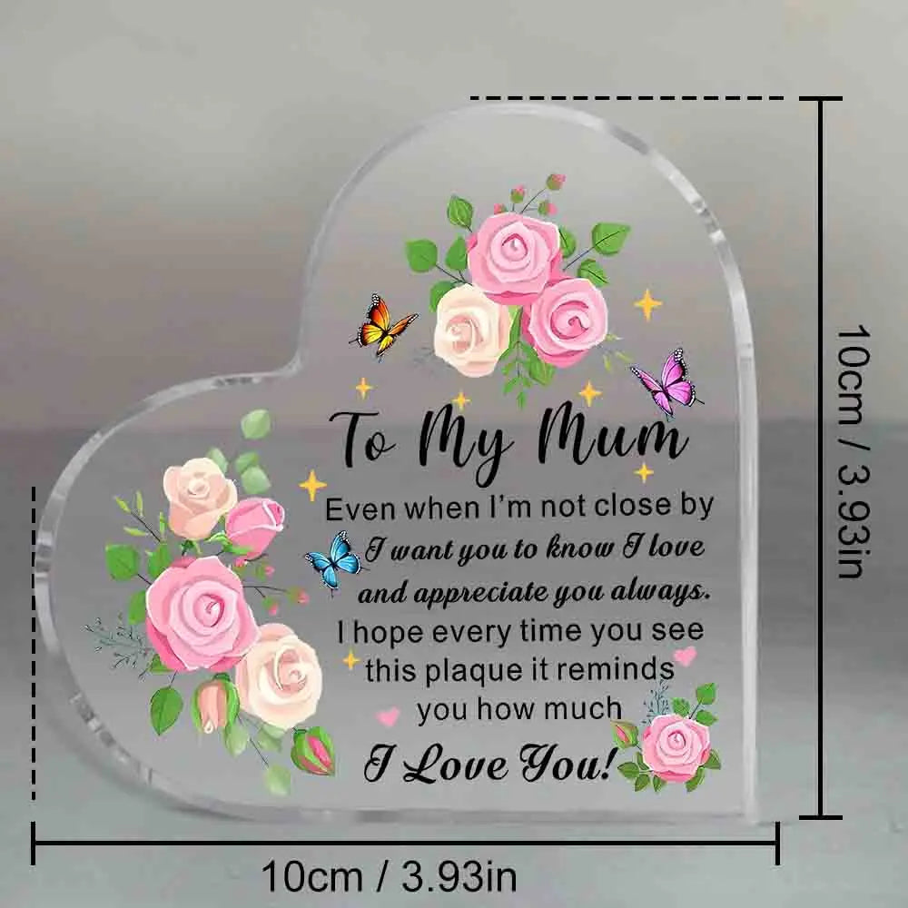Heart-shaped glass plaque with floral design and message to 'My Mum' on a gray background