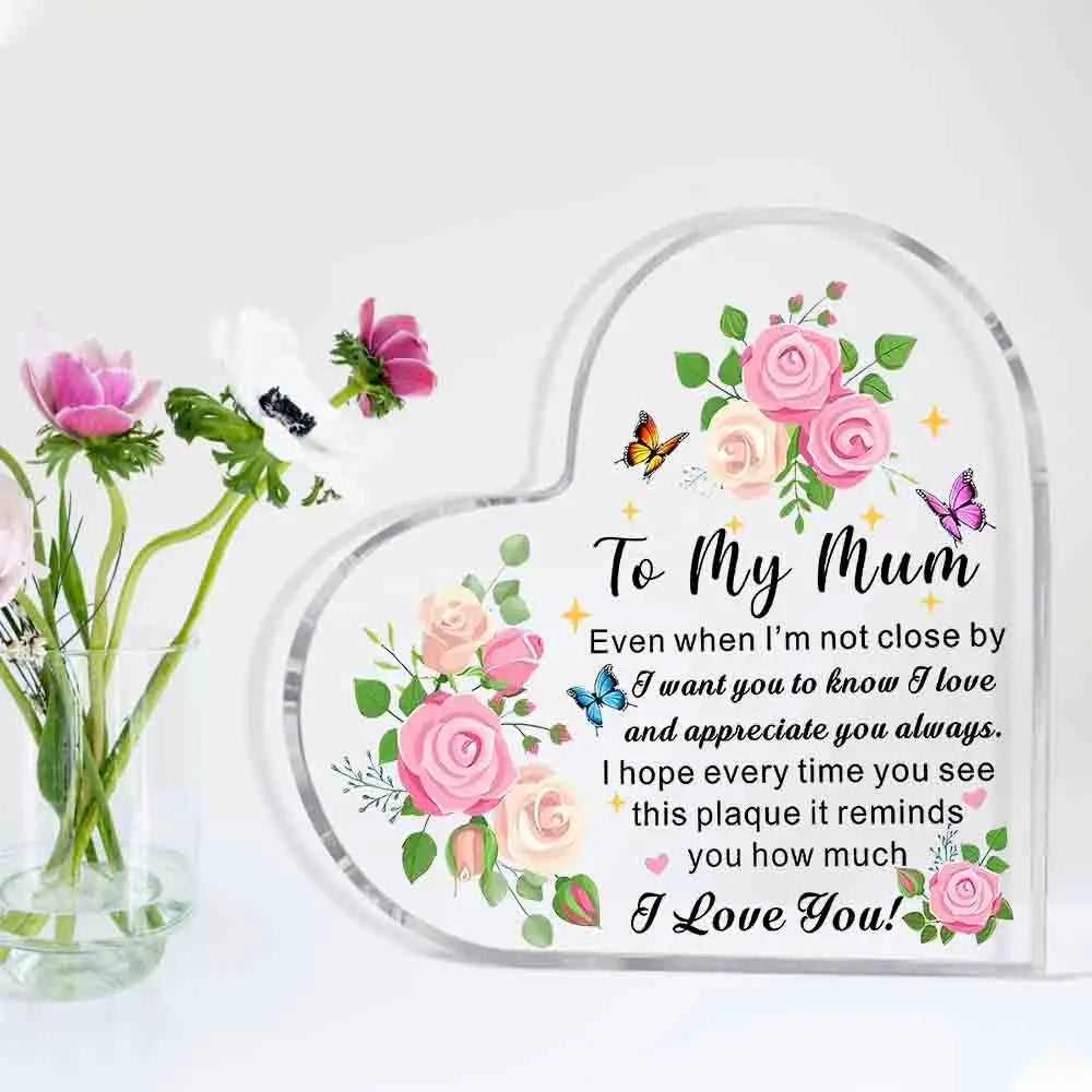Heart-shaped glass plaque with floral design and message to 'My Mum' on a white background
