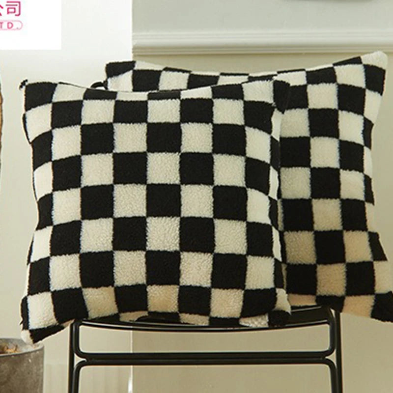 Checkered black and white cushions on a chair