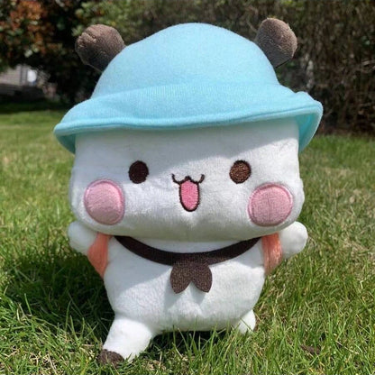 Panda Plush toy with a blue hat and brown horns on grass