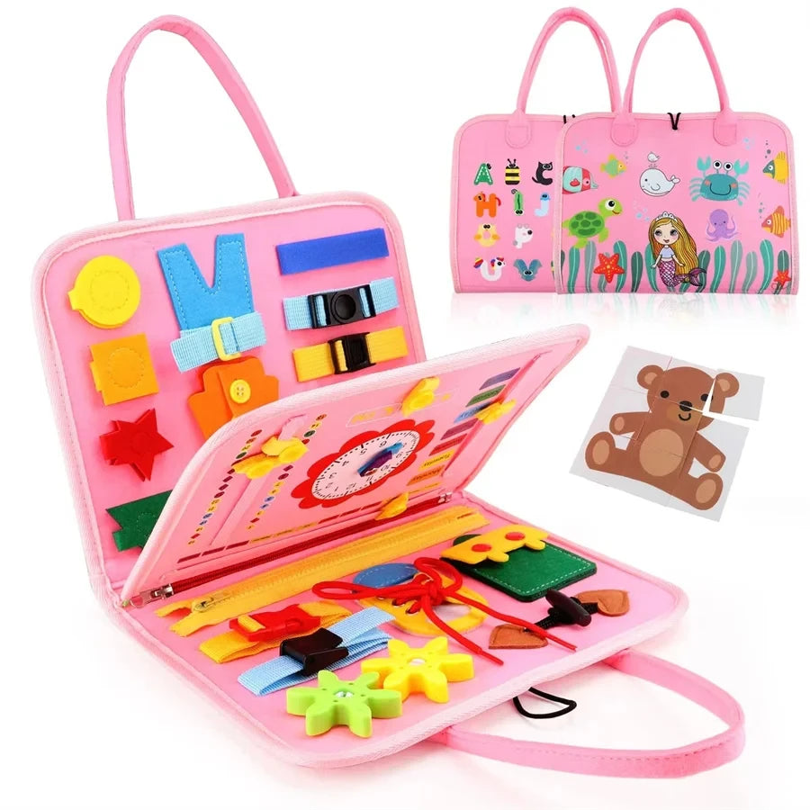 Pink educational busy book sensory toy case with colorful shapes and a small teddy bear picture on a white background