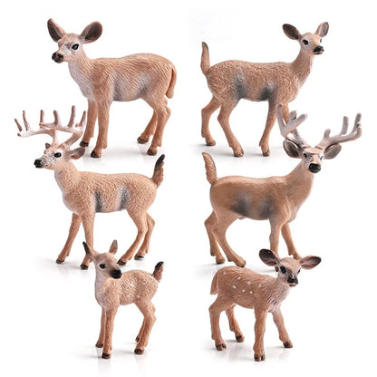 Set of seven realistic deer toy figurines in various sizes and breeds, including fawns and antlered deer, displayed on a clean white background.