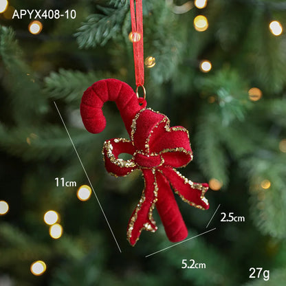 Red candy cane ornament with gold accents on a Christmas tree, showing measurements.