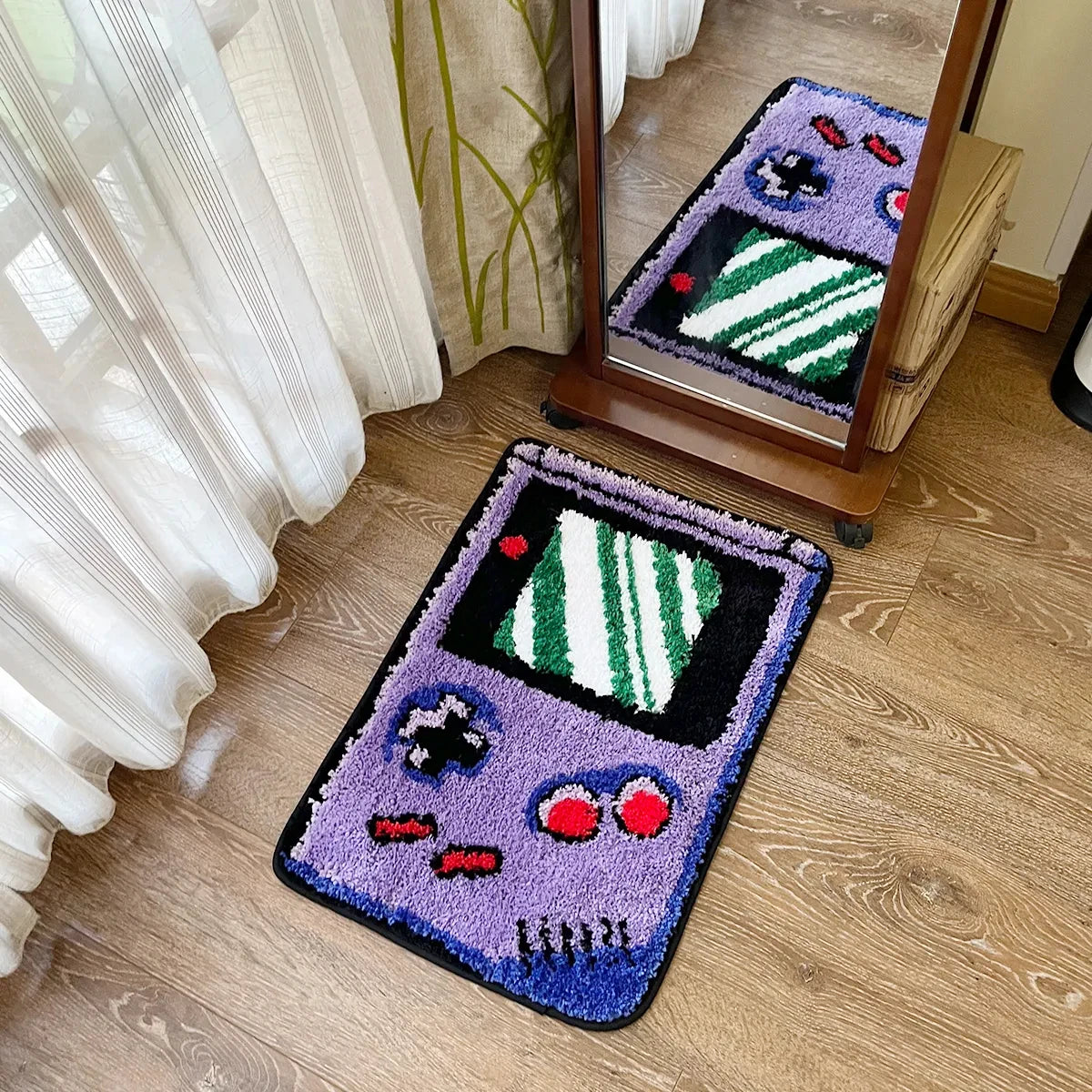 Game console-shaped rug on a wooden floor with a mirror reflecting the rug.