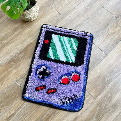Decorative rug shaped like a vintage video game console on a wooden floor.