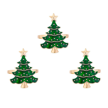 Three green Christmas tree-shaped hair clips with gold bases on a white background