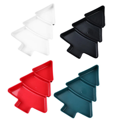 Set of four Christmas tree-shaped trays in white, black, red, and blue on a white background.