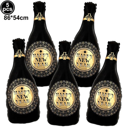Set of five black and gold 'Happy New Year' decorative bottles on a white background