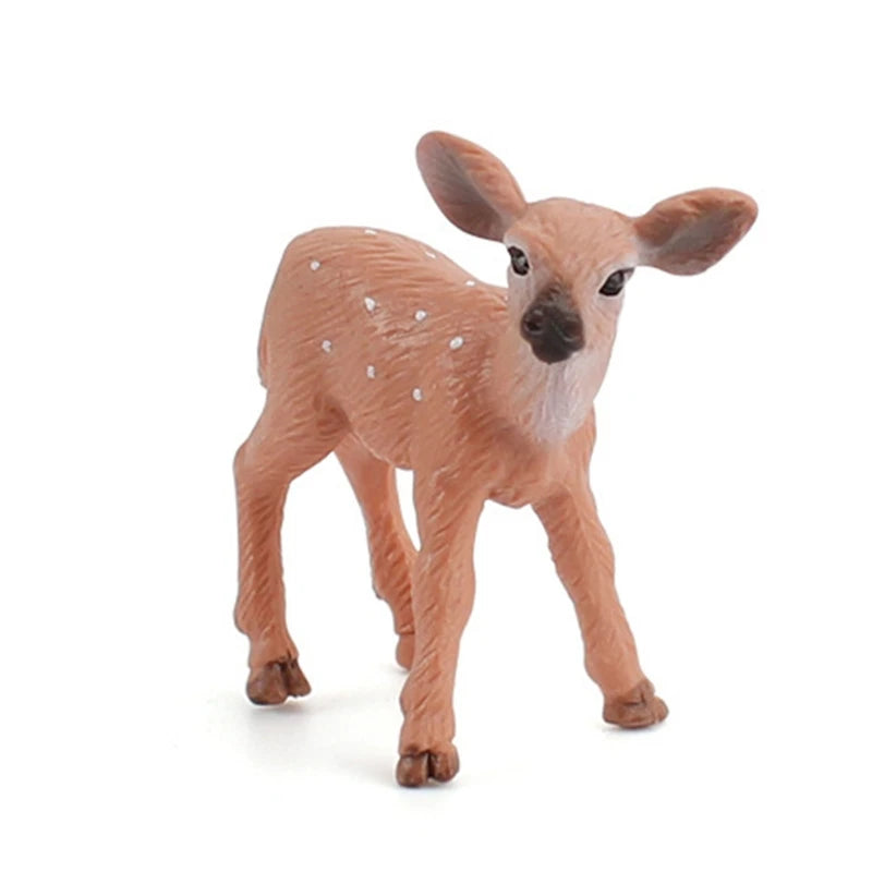 A small plastic toy fawn figurine with brown fur and white spots, standing on a white background.